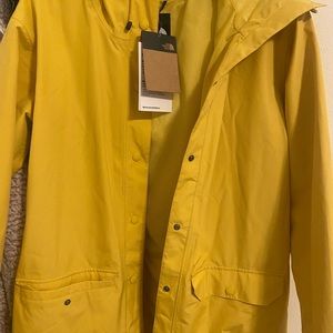 Yellow North face rain jacket brand new